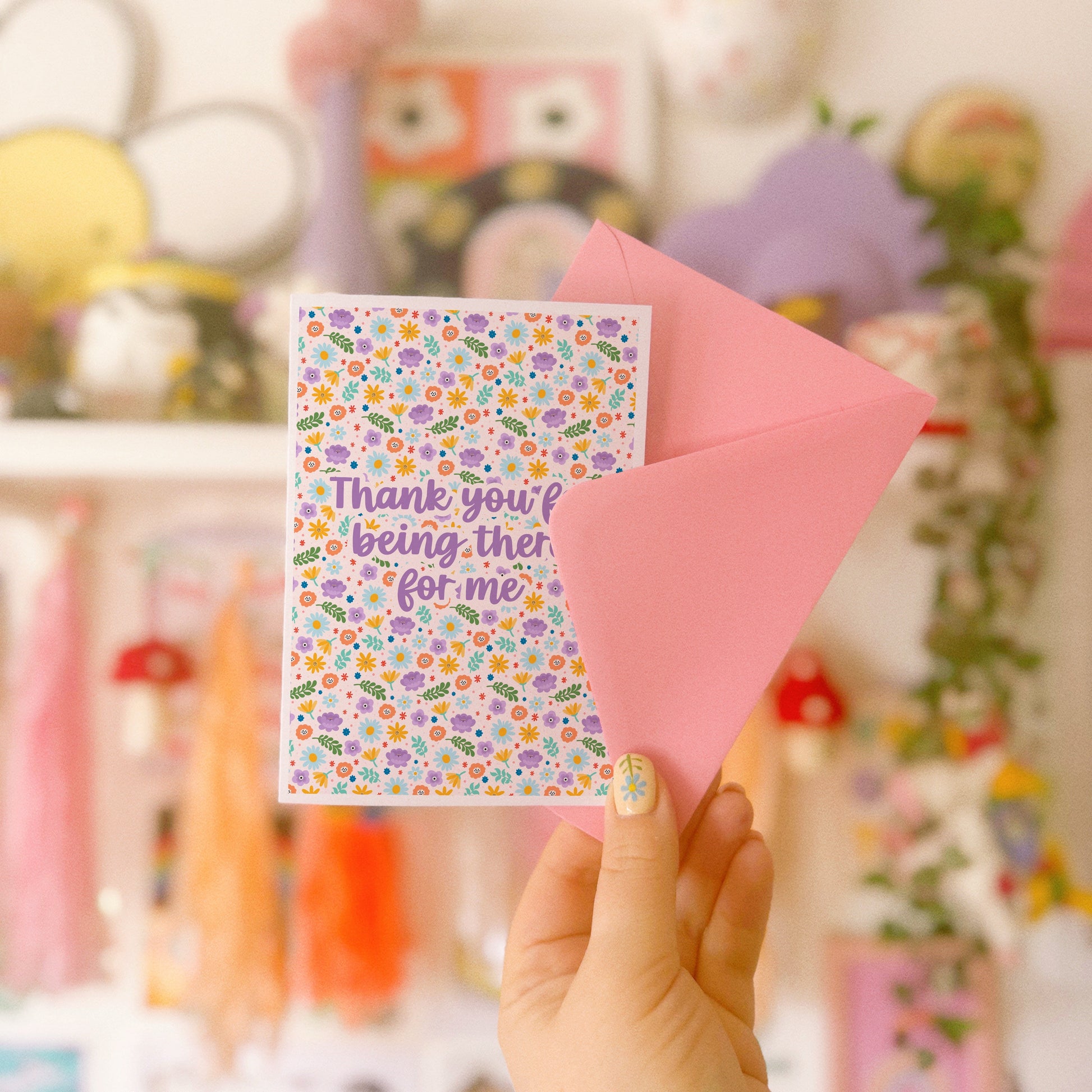 A colourful floral card with hand lettered text that reads 'thank you for being there for me'.