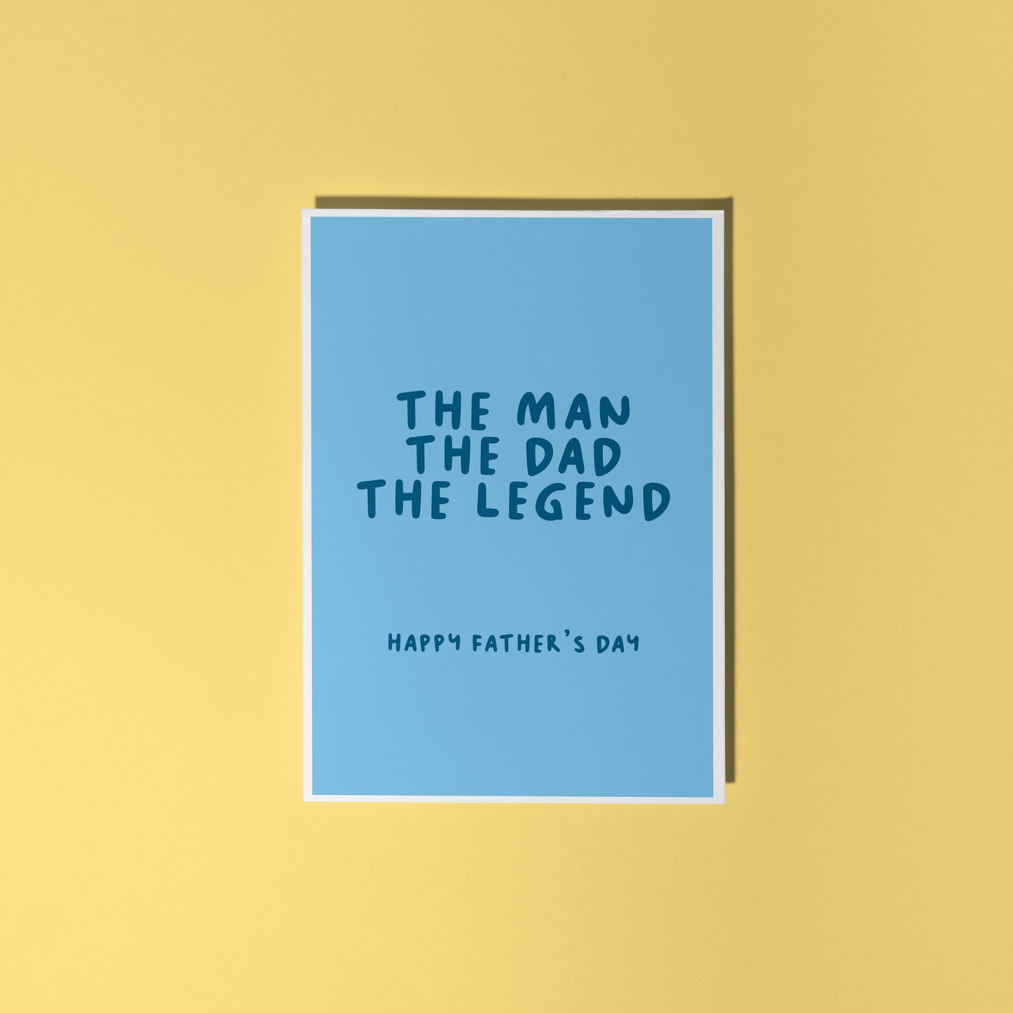A blue card with text that reads 'the man the dad the legend, happy fathers day'.