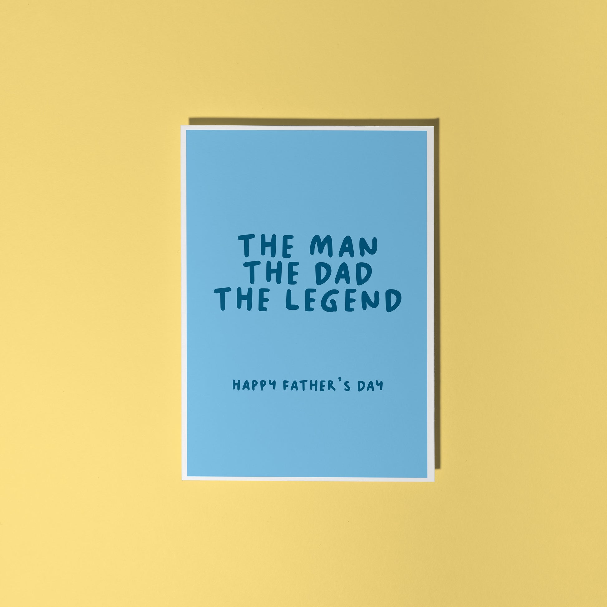 A blue card with text that reads 'the man the dad the legend, happy fathers day'.
