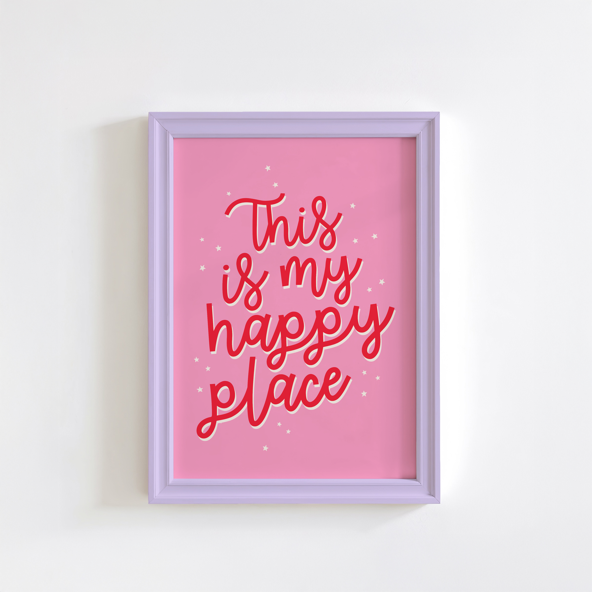 A bold pink print with a quote in red that reads 'this is my happy place'.