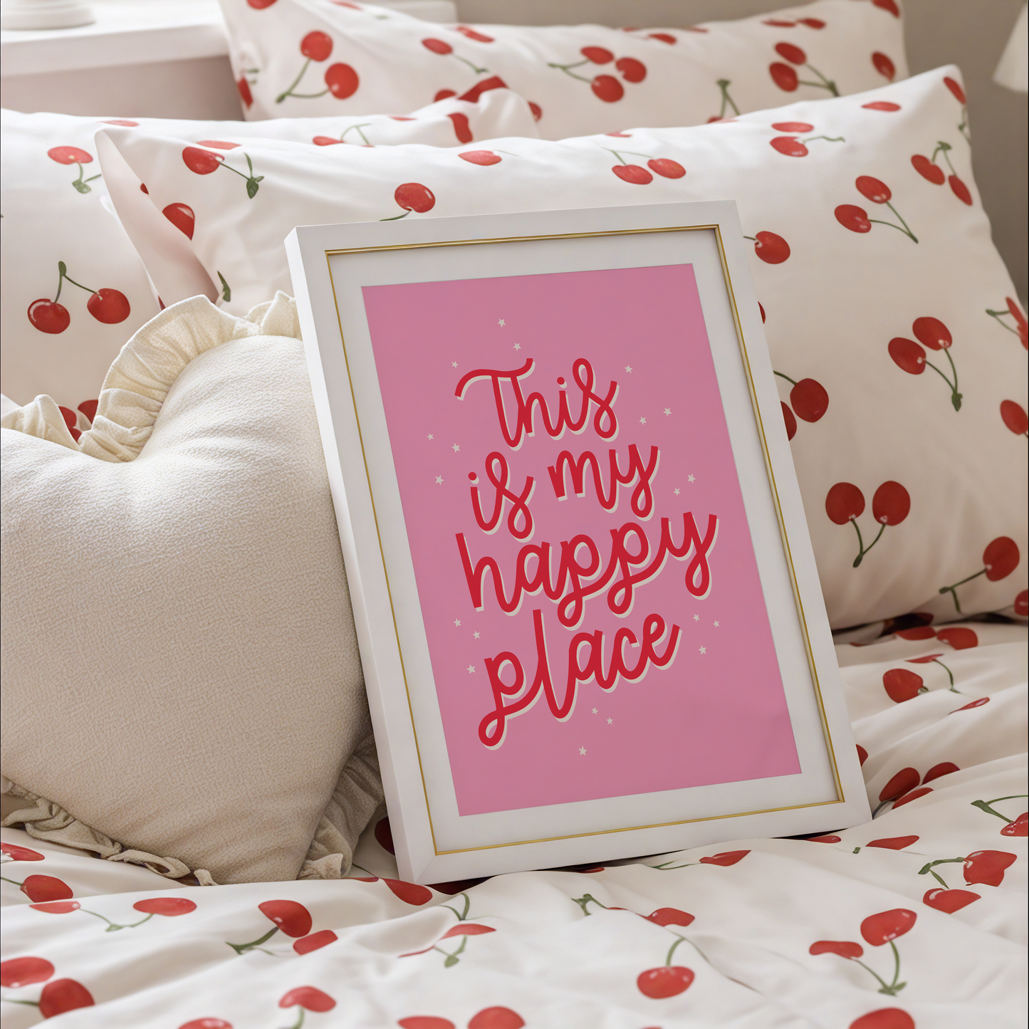 A bold pink print with a quote in red that reads 'this is my happy place'.