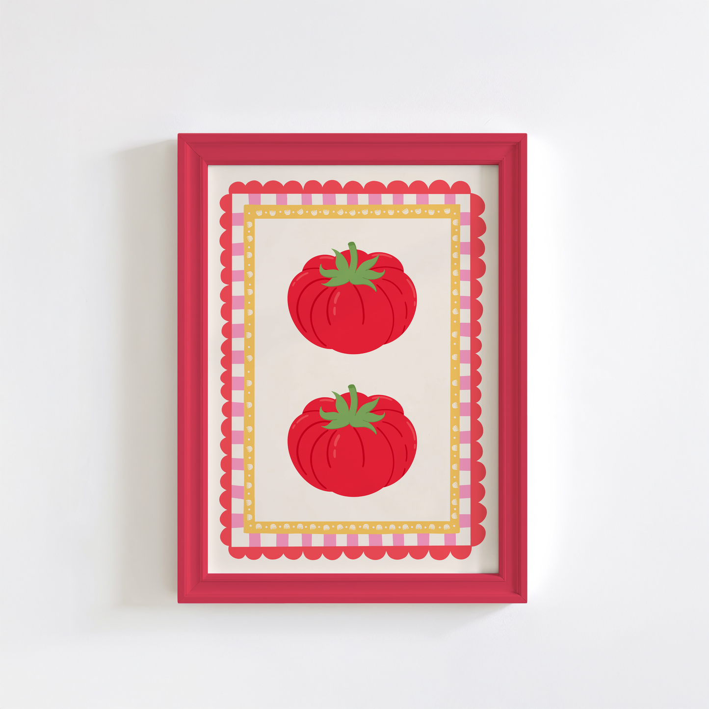 Framed artwork with two red tomatoes on a white background
