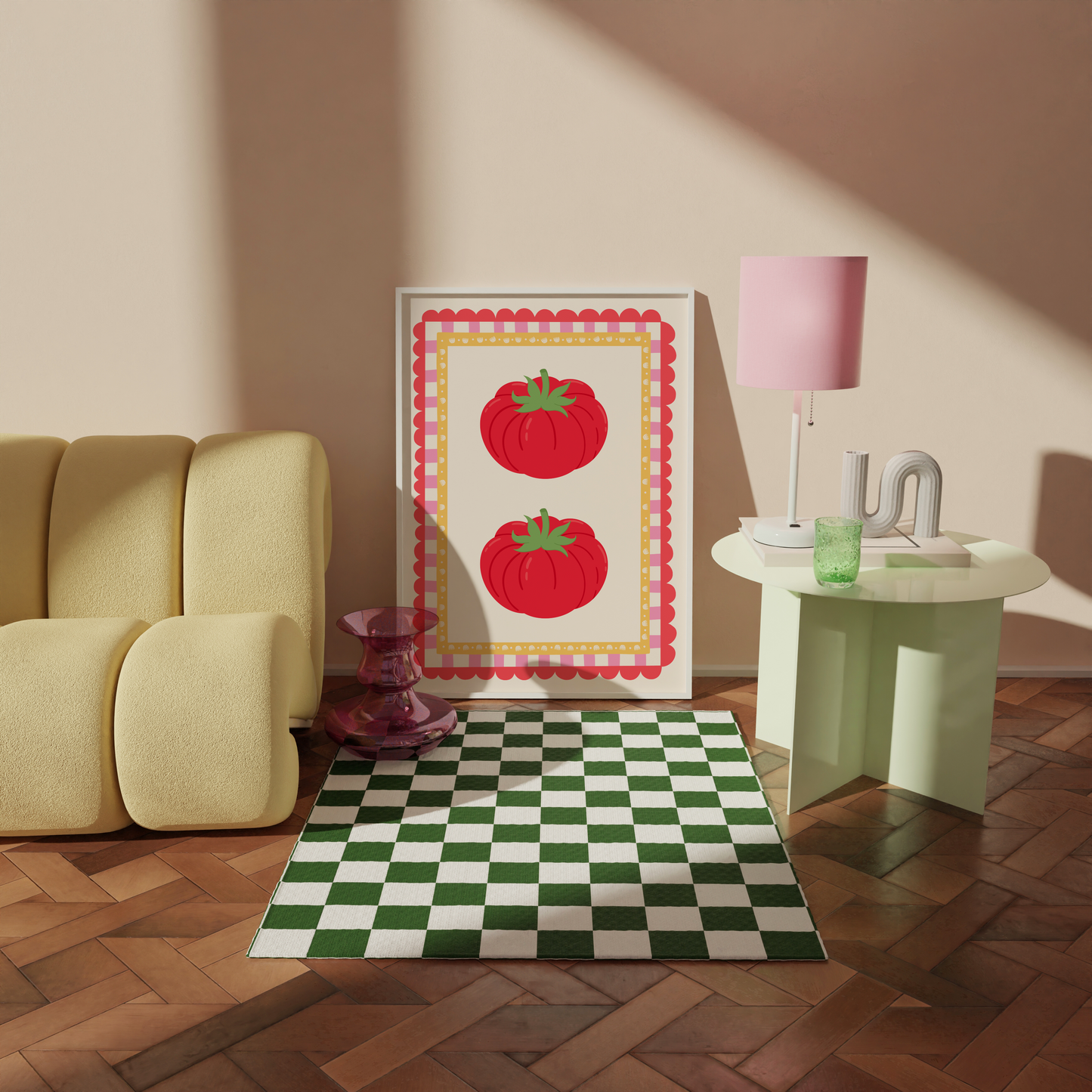 Living room with a yellow sofa, checkered rug, and framed artwork of red tomatoes.