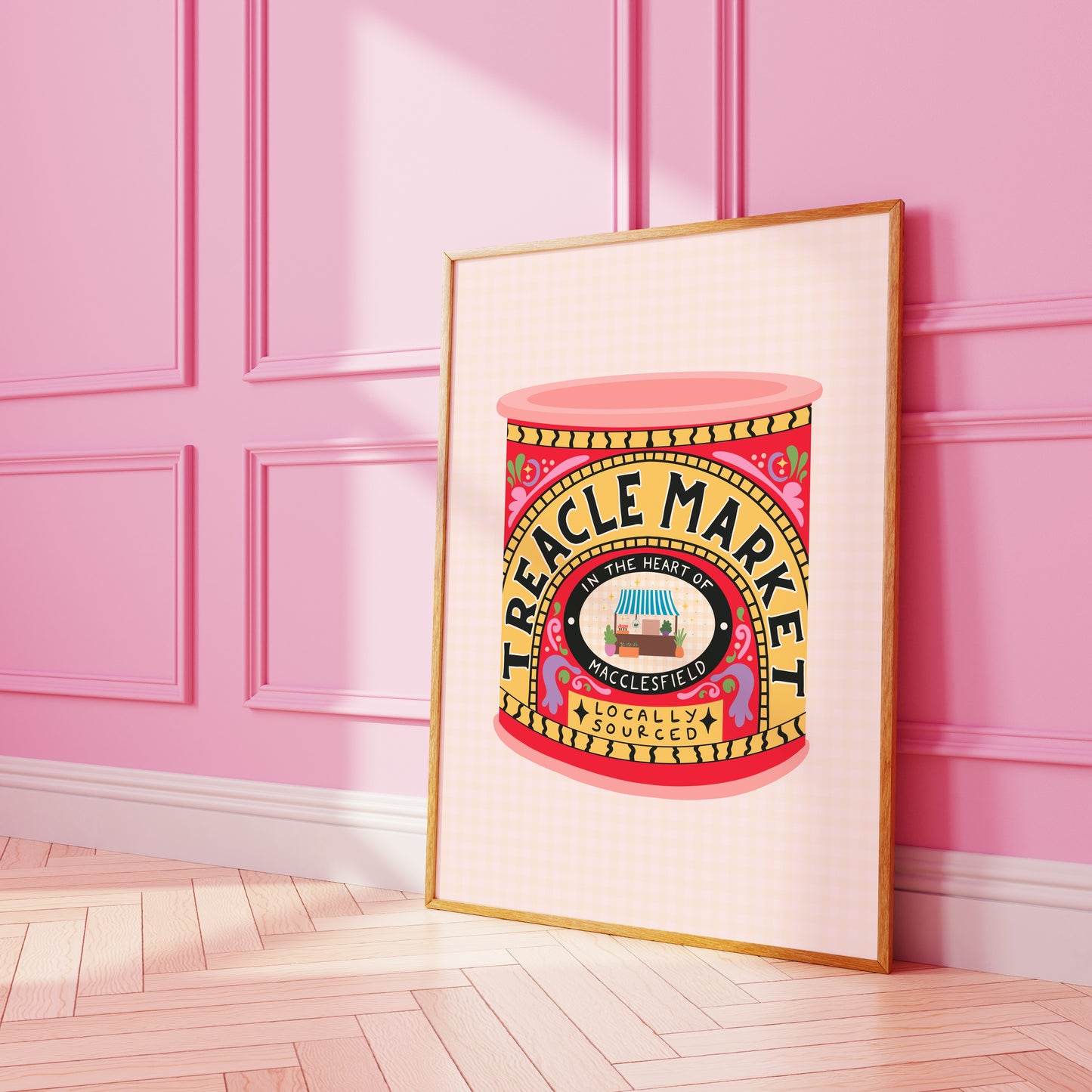 An illustrated art print of a a tin of treacle - but designed in ode to the Treacle Market in Macclesfield. THe print has bold red and yellow hues. 