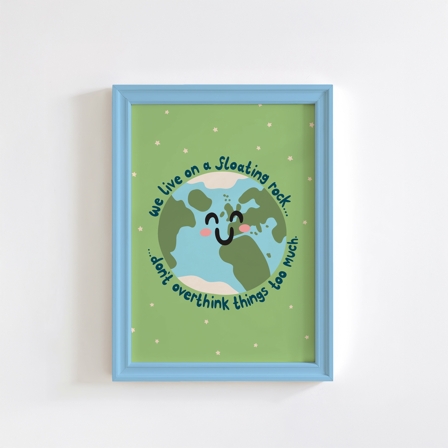 A green print with an illustration of a smiling planet earth. Around the earth is text that reads 'we live on a floating rock... don't overthink things too much.'