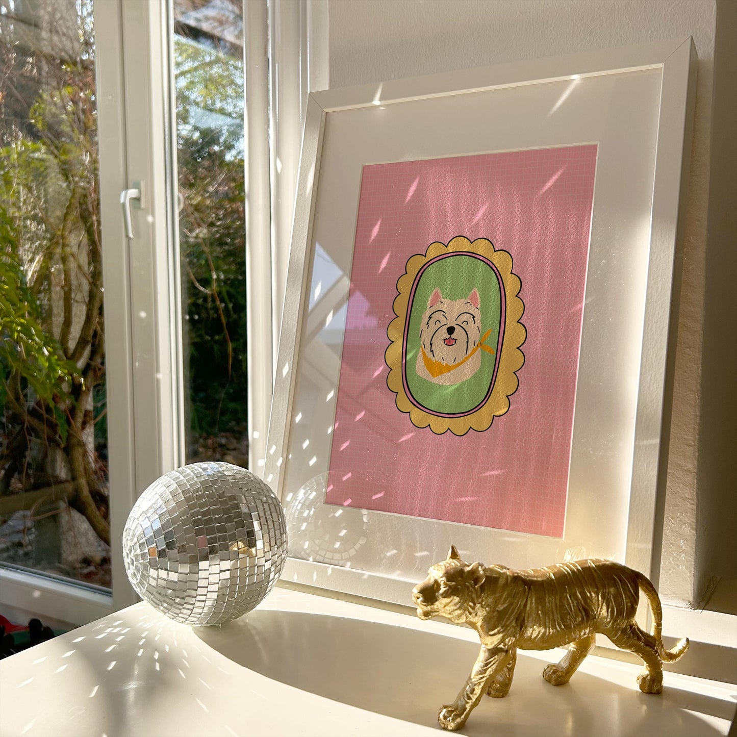 A print of a West Highland Terrier with a pink background and a yellow scalloped frame.