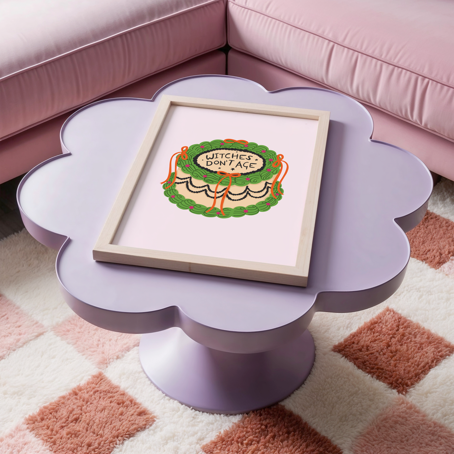 A Halloween print featuring an illustration of a cake, with green, orange and black icing. The words on top of the cake read 'witches don't age'.