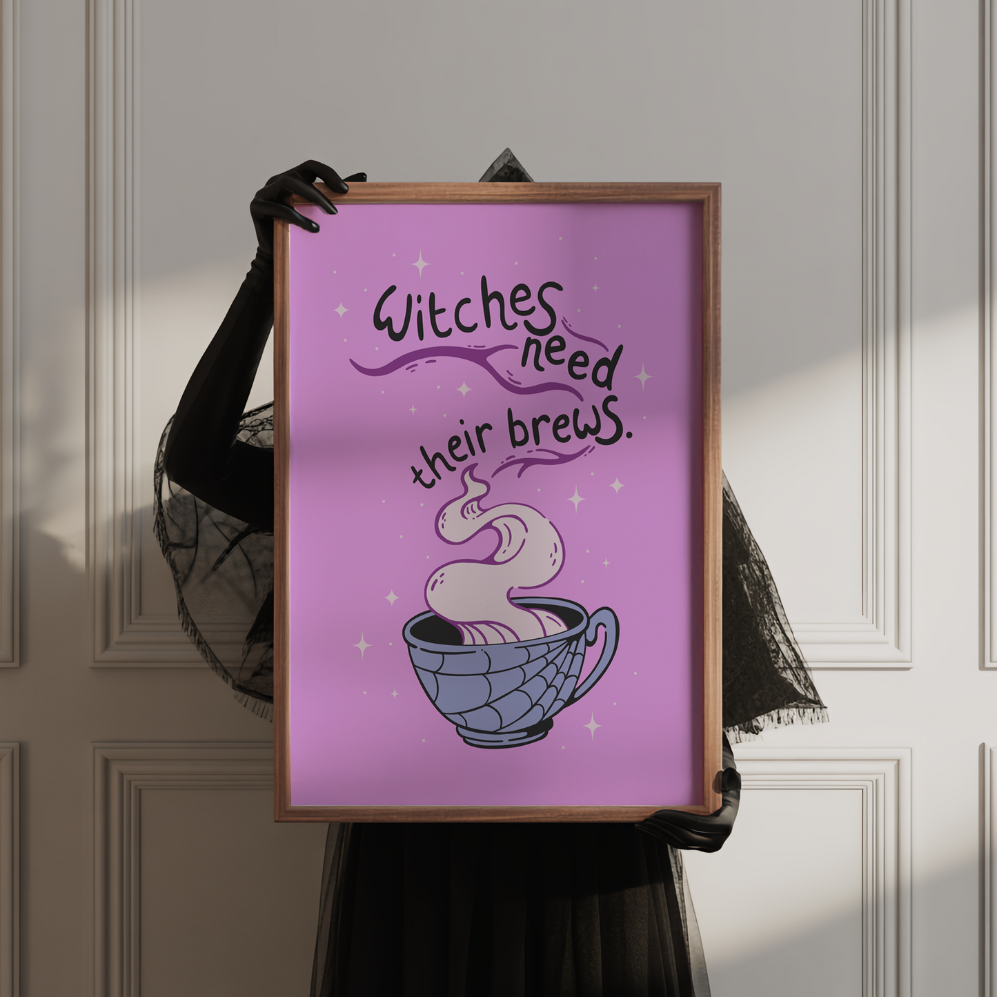 A purple Halloween illustration print, that features a spooky mug with steam coming out of it. Within the steam are the words 'witches need their brews'.