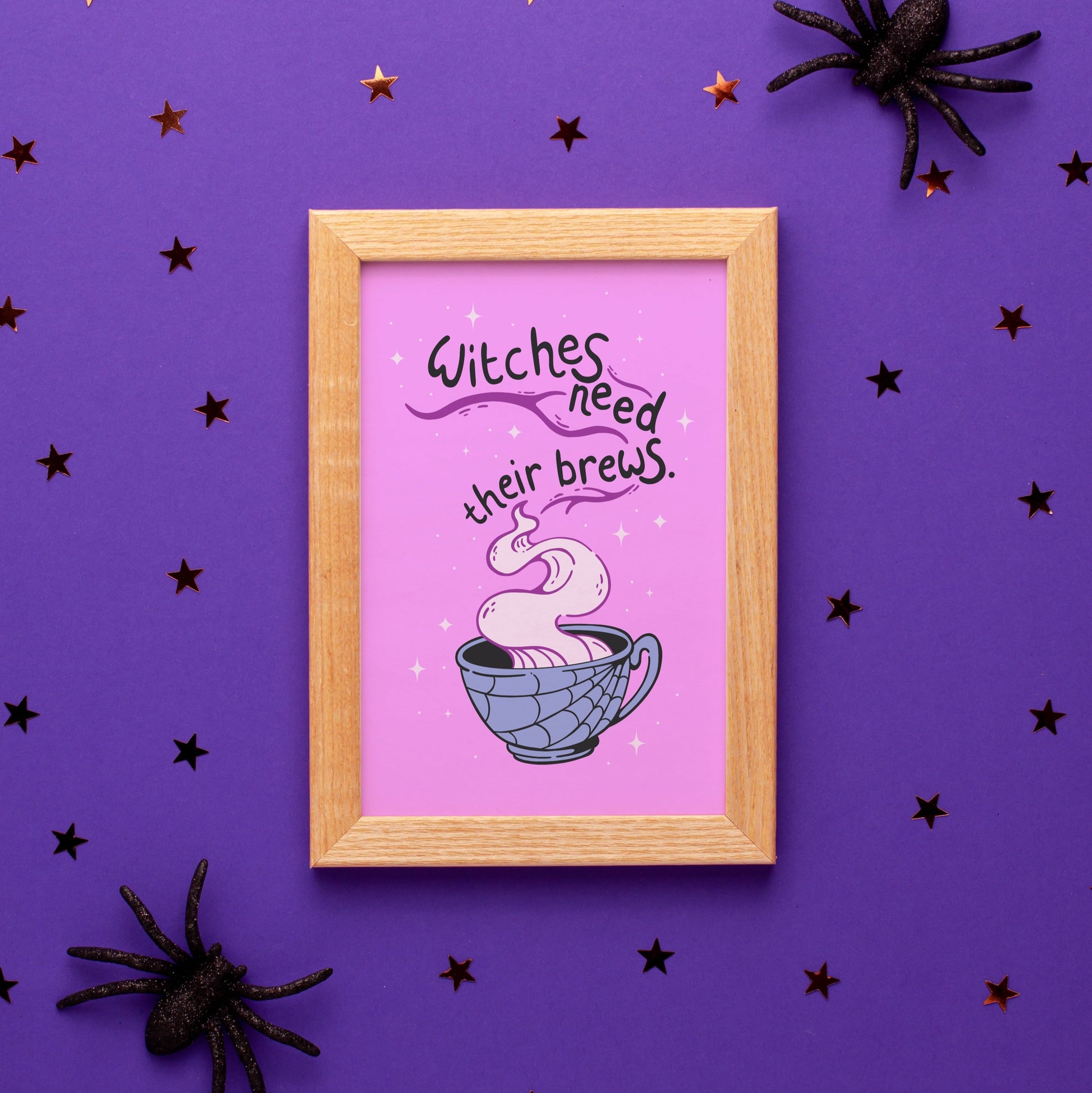 A purple Halloween illustration print, that features a spooky mug with steam coming out of it. Within the steam are the words 'witches need their brews'.