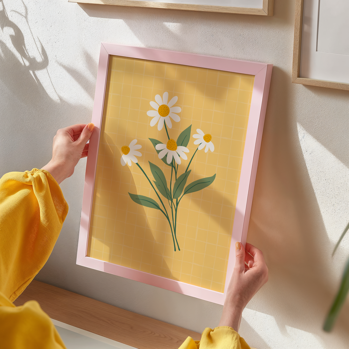 A yellow print with an illustration of a bunch of white daisies on.