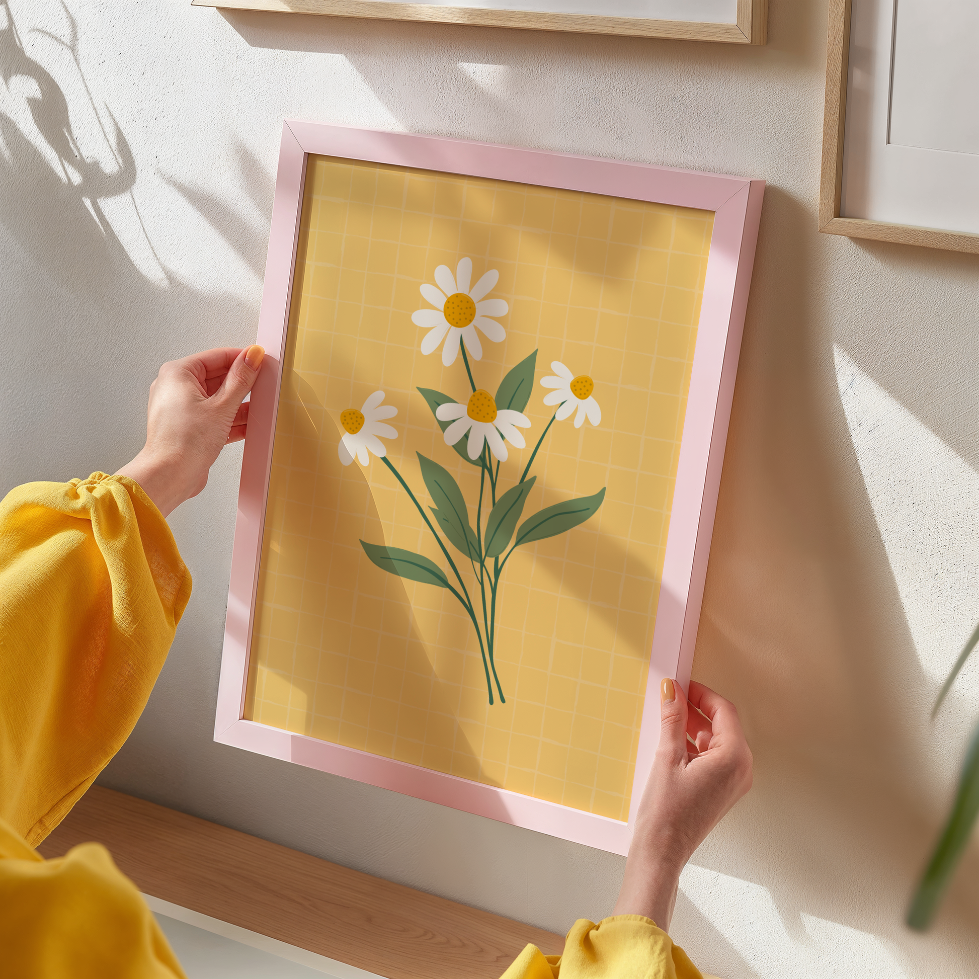 A yellow print with an illustration of a bunch of white daisies on.