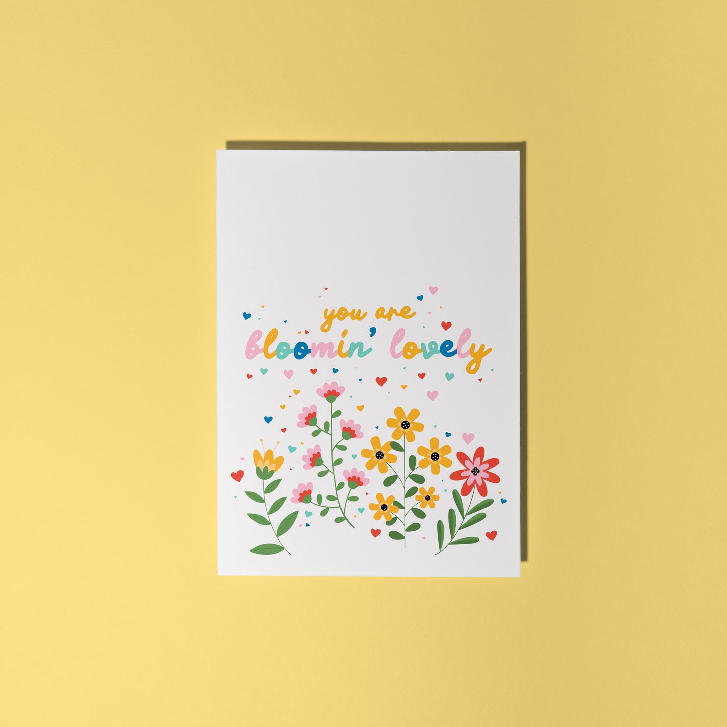 A card with floral illustrations and text that says you are bloomin' lovely