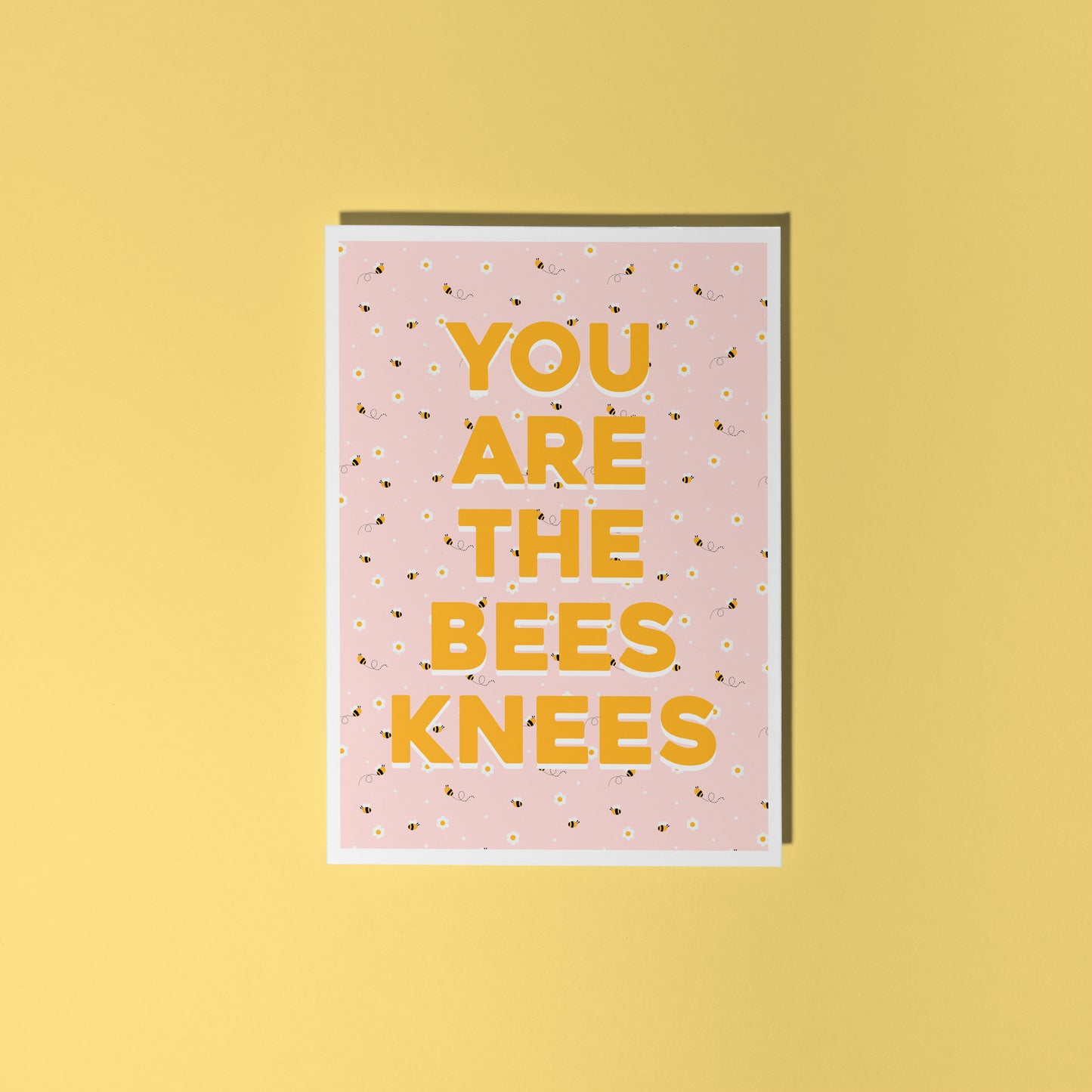 Card with 'YOU ARE THE BEES KNEES' text on a pink background with bee illustrations against a yellow background