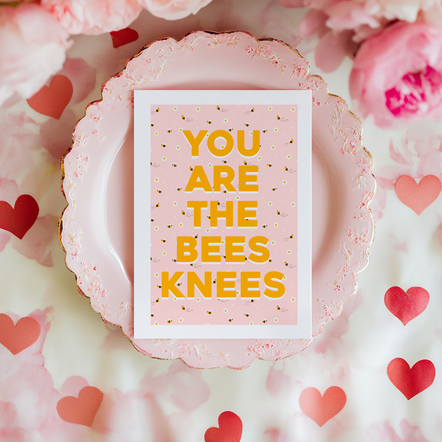 a card with a repeating pattern of buzzing bees, and text that reads 'you are the bees knees' in yellow.