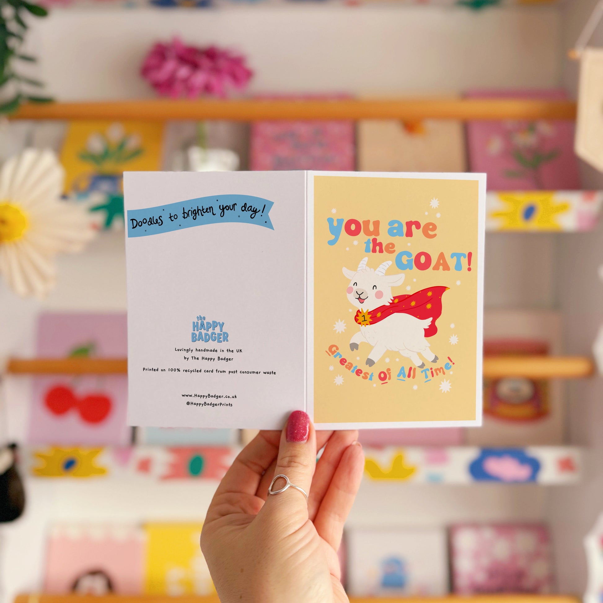 A greetings card with a goat illustration, and hand lettered text that reads 'you are the goat! (greatest of all time!)'.
