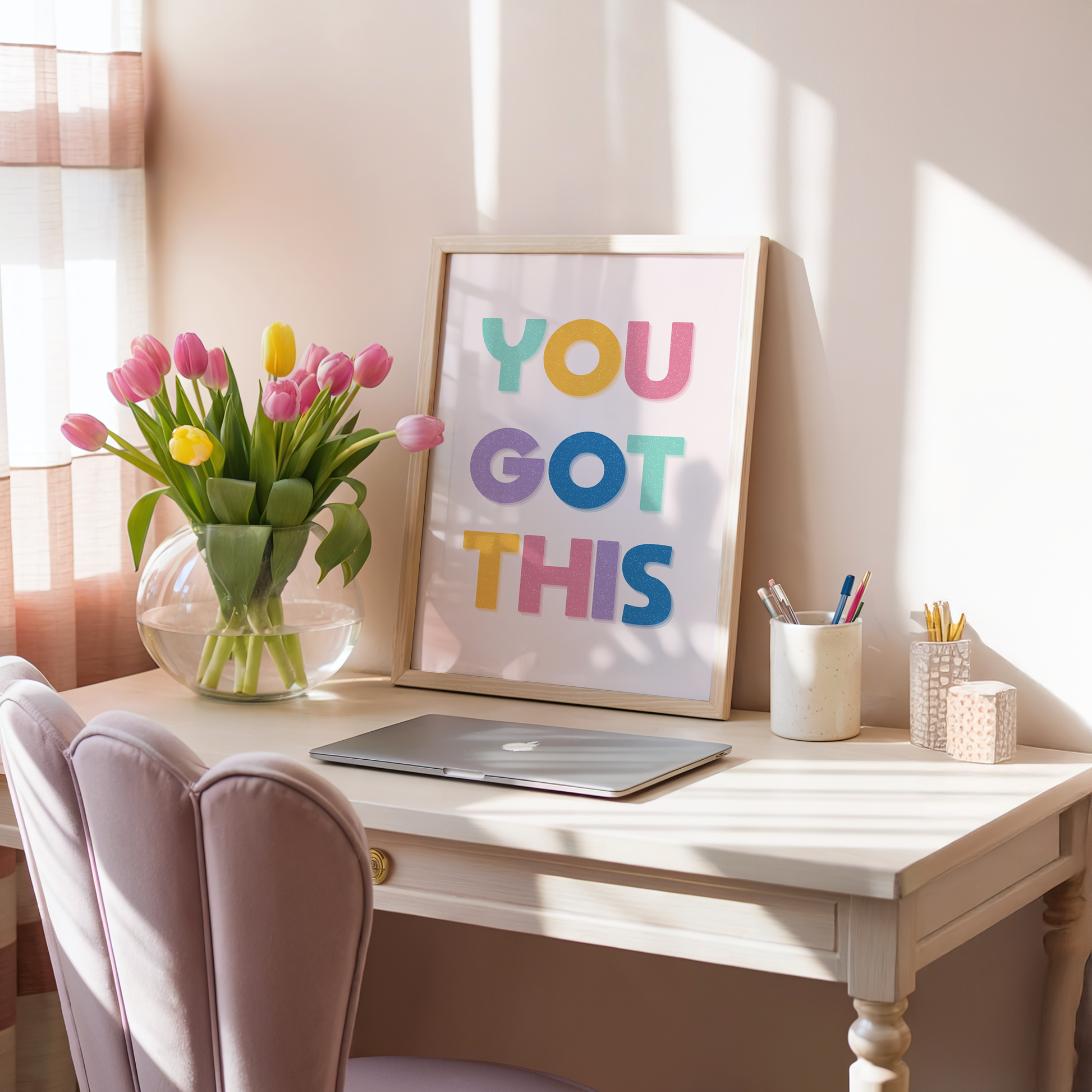 A motivational print with multicoloured lettering, saying You Got This.