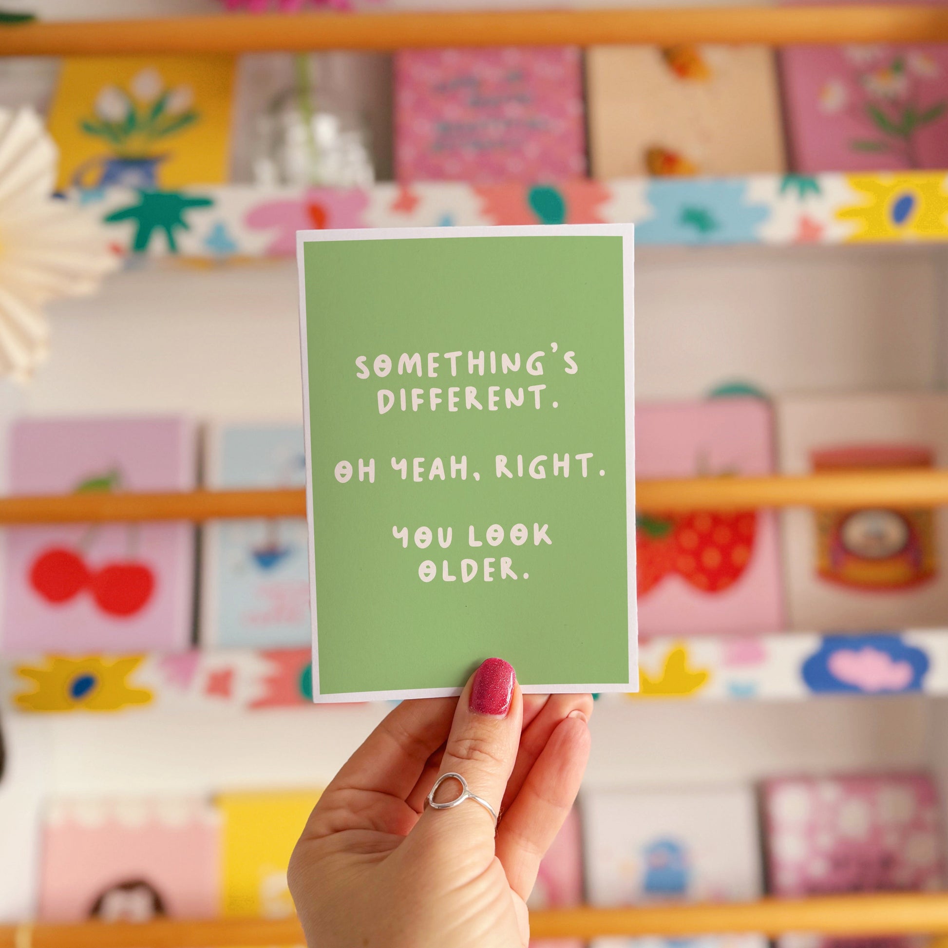 A simple birthday card, with a funny sarcastic message on the front which reads 'Something's different. Oh yeah, right. You look older.'