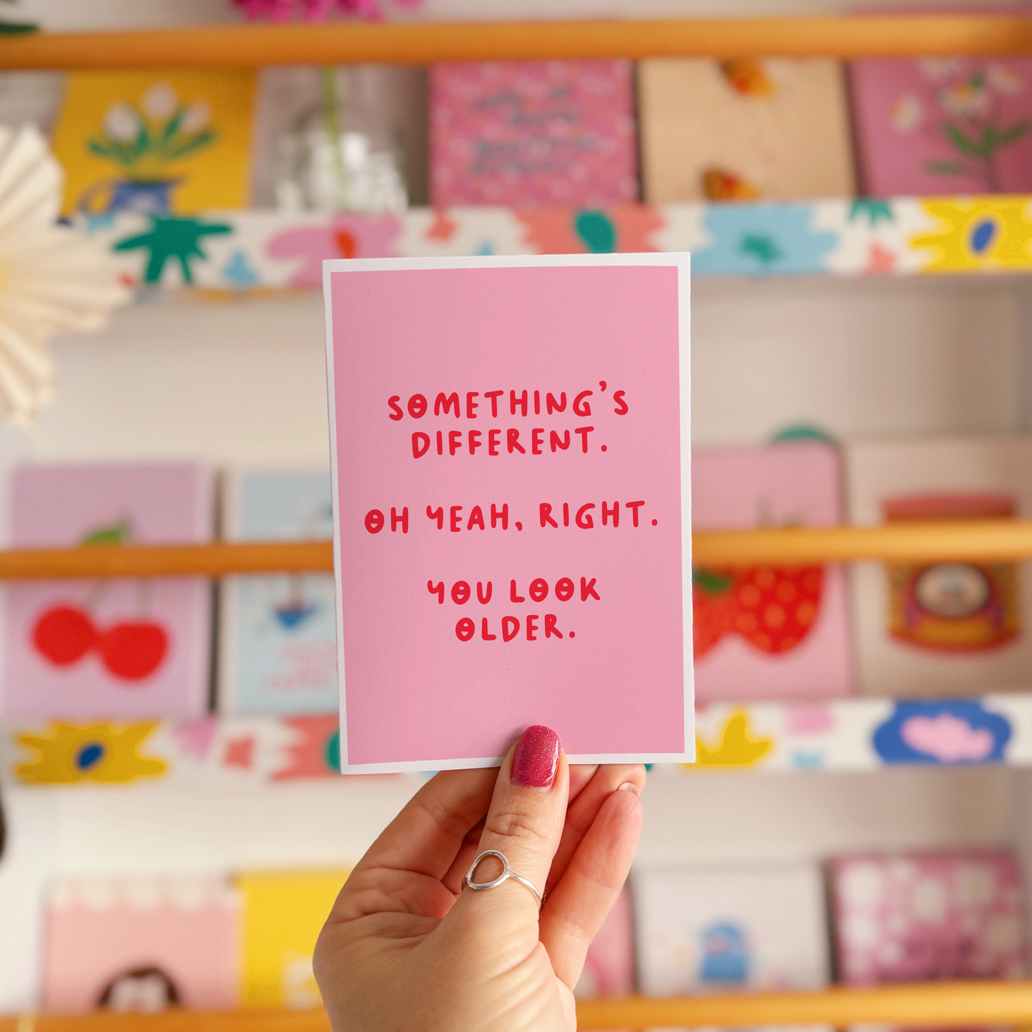 A simple birthday card, with a funny sarcastic message on the front which reads 'Something's different. Oh yeah, right. You look older.'