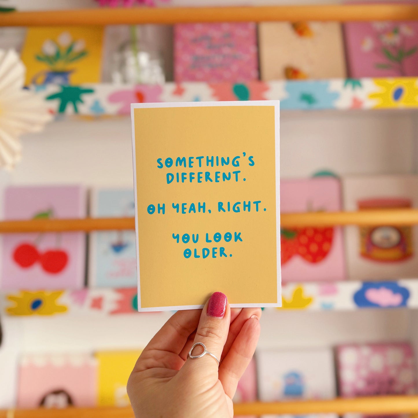 A simple birthday card, with a funny sarcastic message on the front which reads 'Something's different. Oh yeah, right. You look older.'