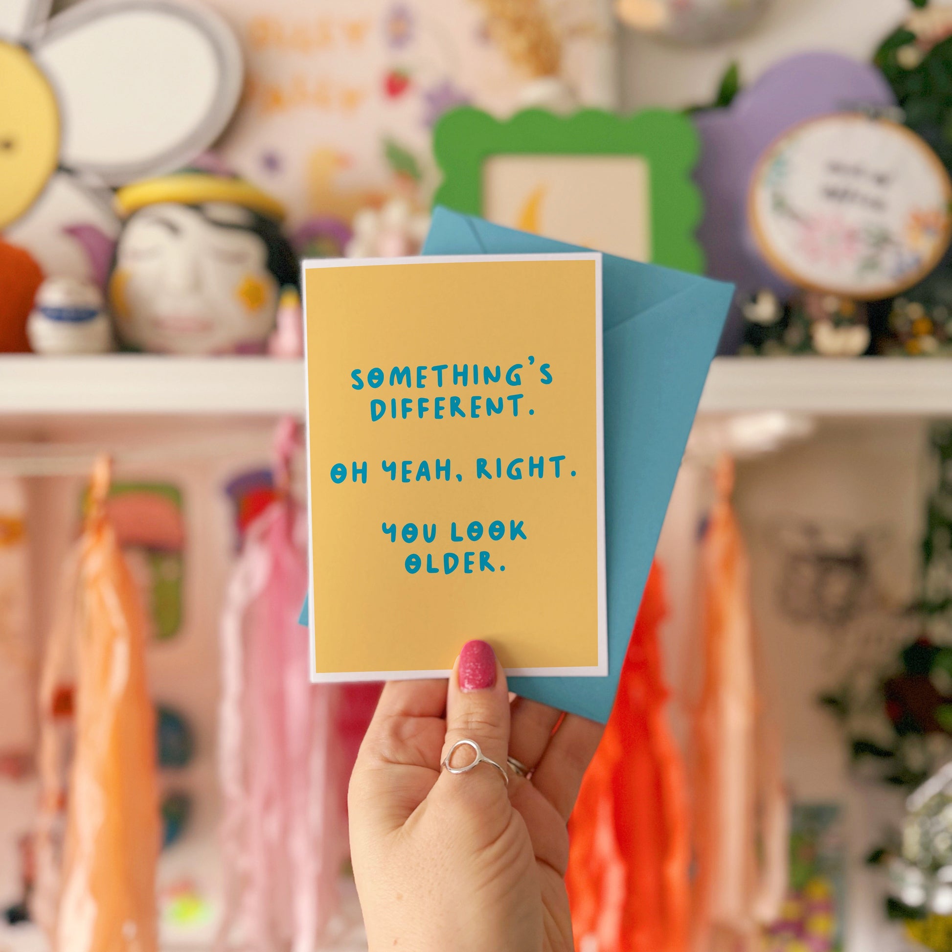 A simple birthday card, with a funny sarcastic message on the front which reads 'Something's different. Oh yeah, right. You look older.'
