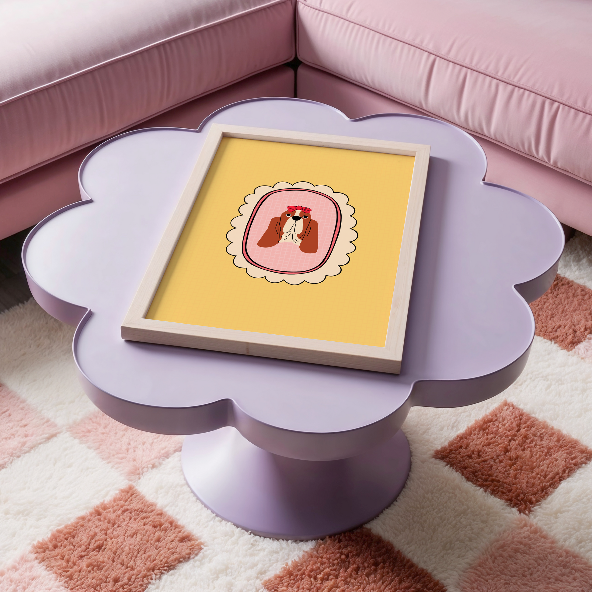 Floral-shaped side table with a framed picture of a basset hound on top, in a room with pink sofa and checkered rug.
