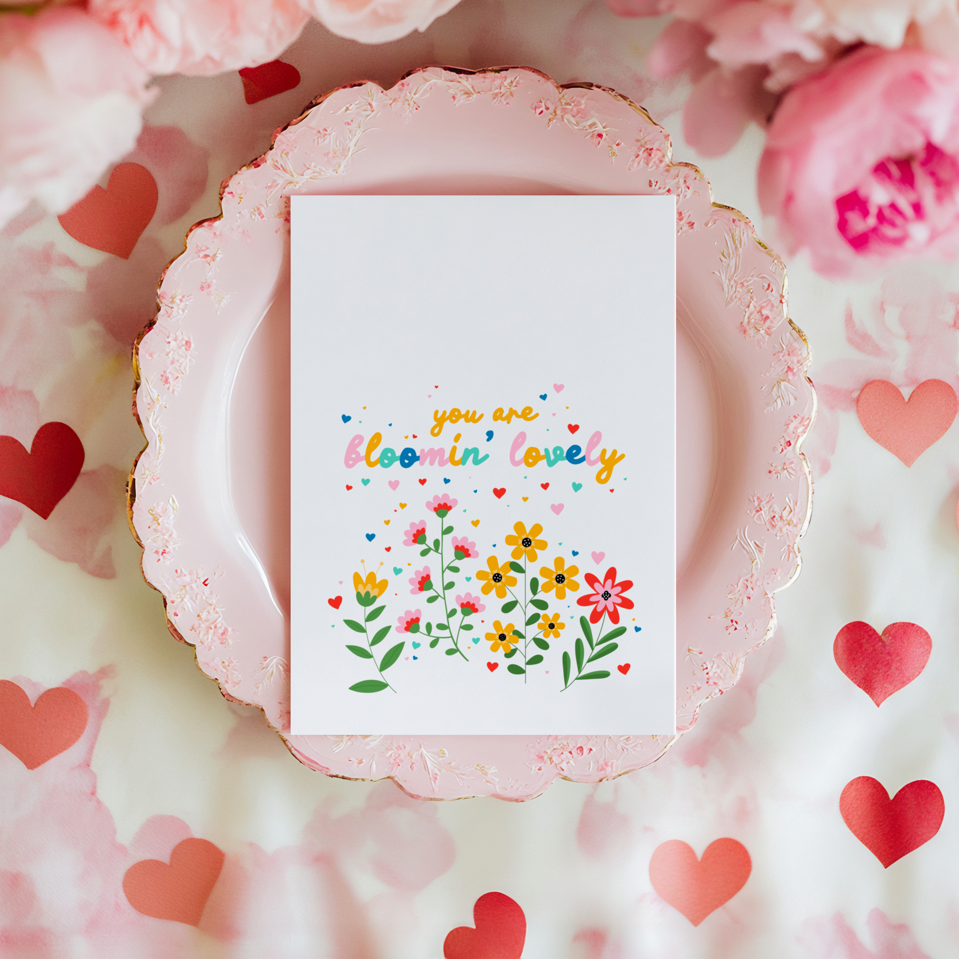 A card with floral illustrations and text that says you are bloomin' lovely