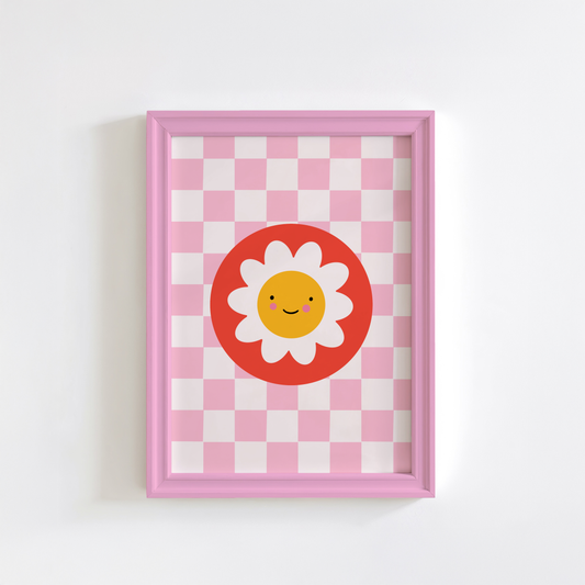 An illustration of a pink checkerboard print, with a smiling daisy in a red circle, shown in a pink frame.