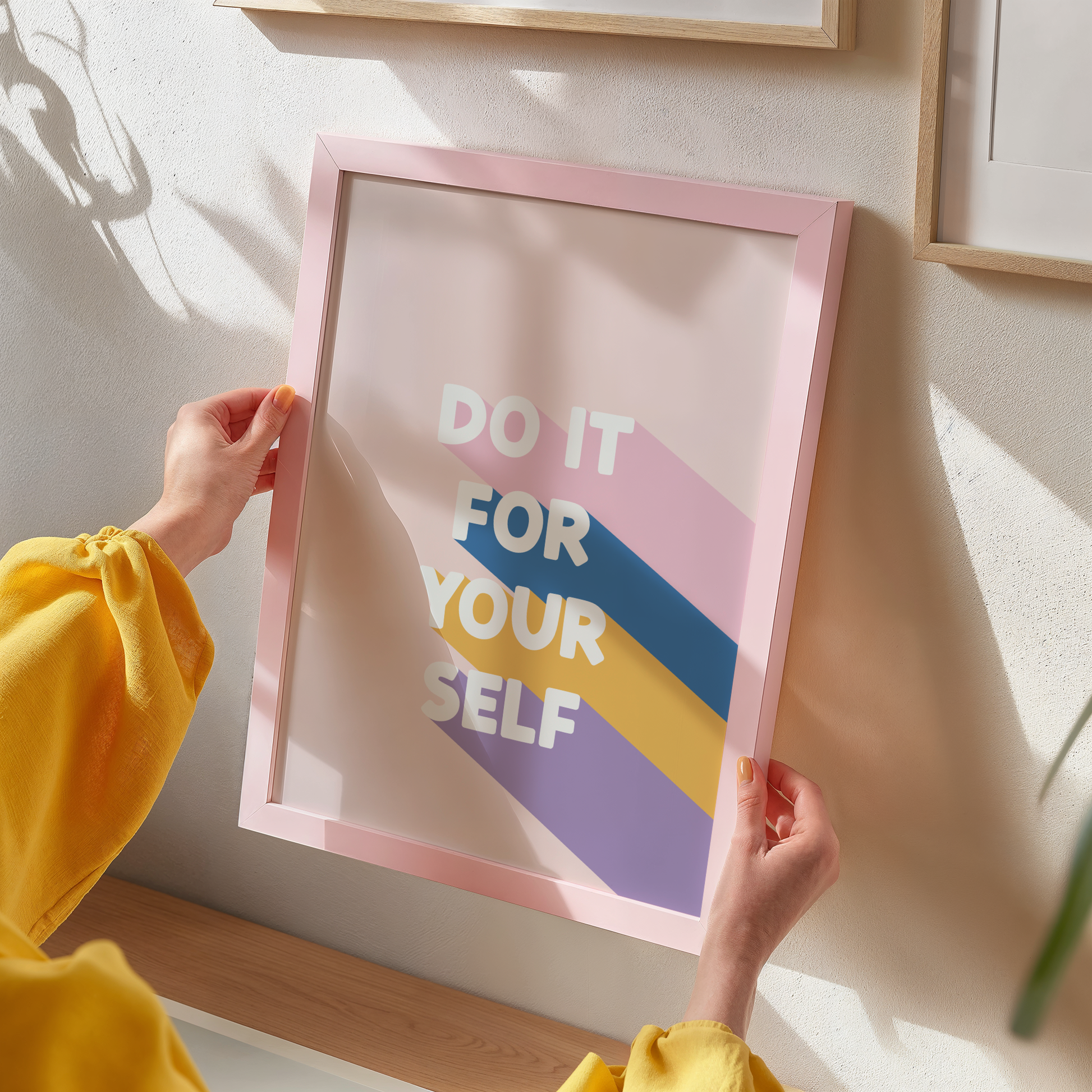 a peachy pink print, with the words 'do it for yourself' with stripes of pink, blue, yellow and purple behind.