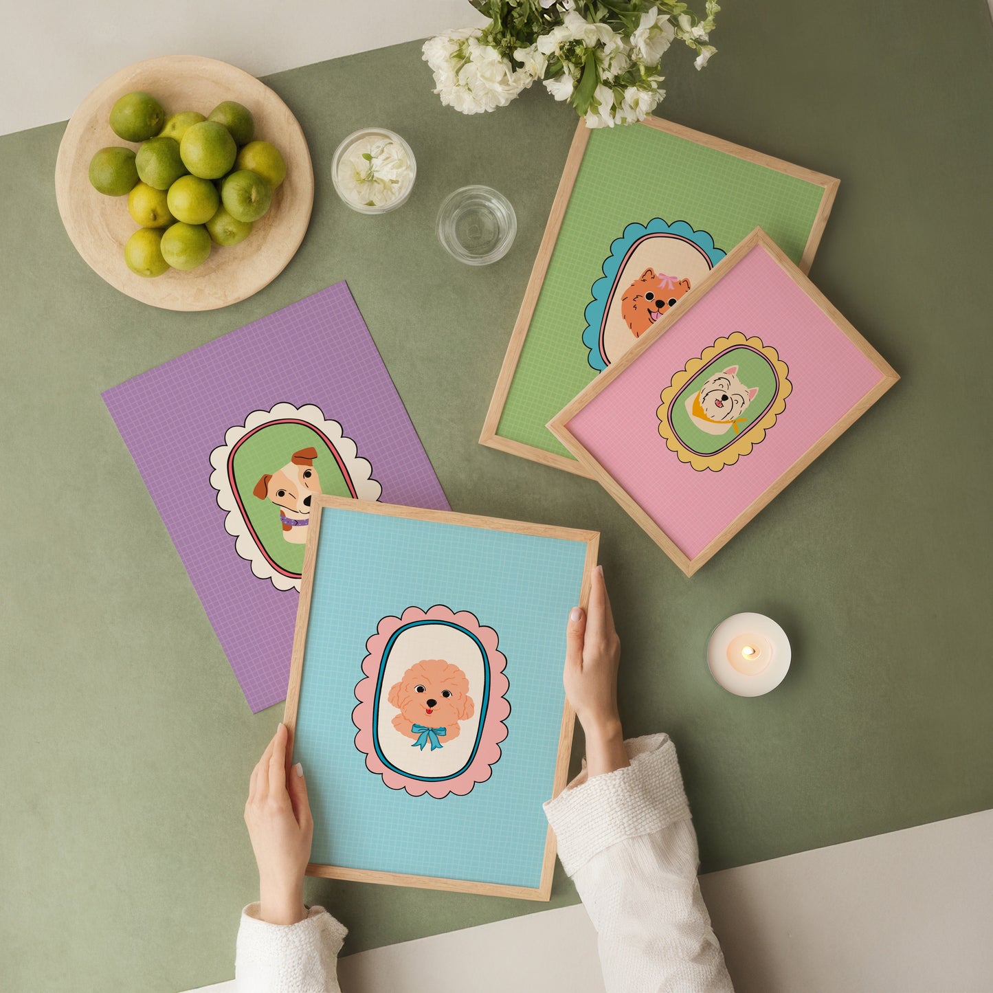 Four colorful cards with cartoon dog designs on a green table.