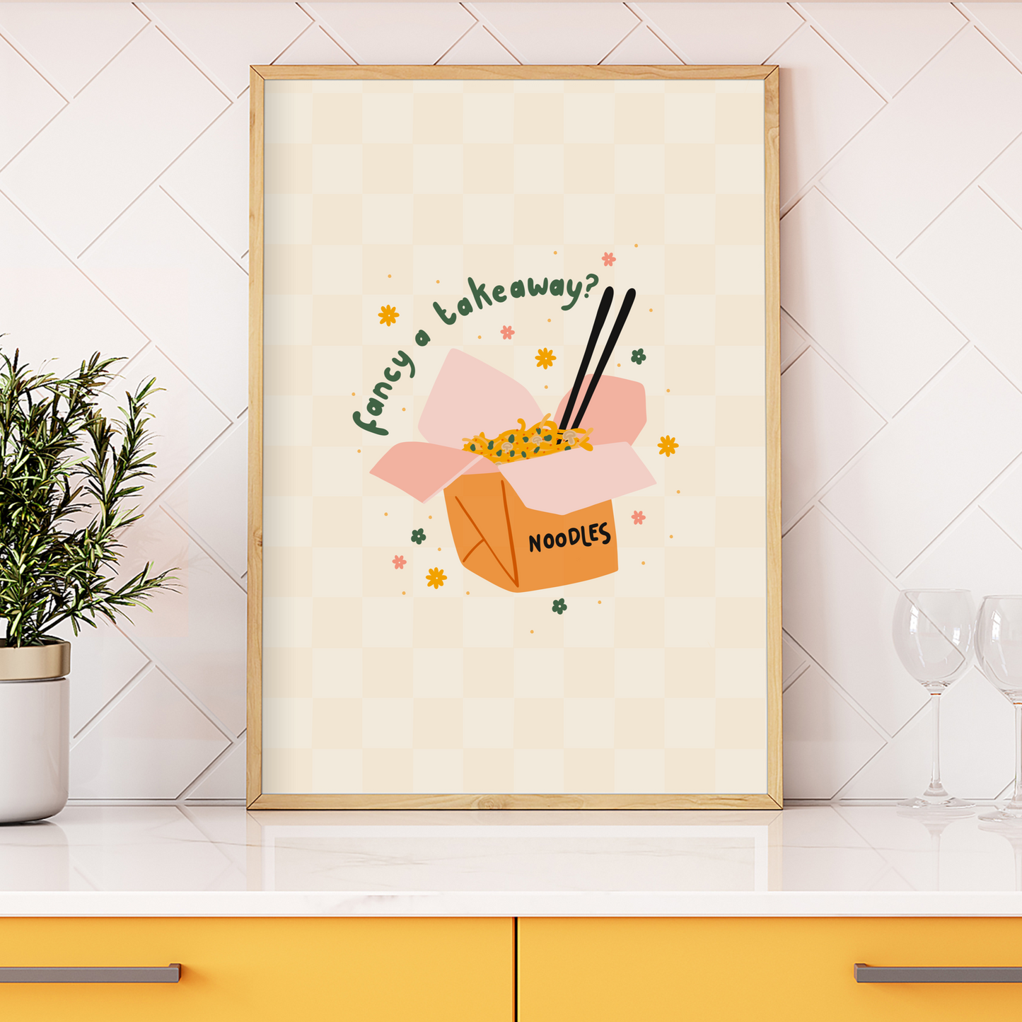 An illustrated art print, featuring a box of take-out noodles, with the words 'Fancy a takeaway?' around the top of the box. The print sits on a pale yellow and cream checkerboard background.