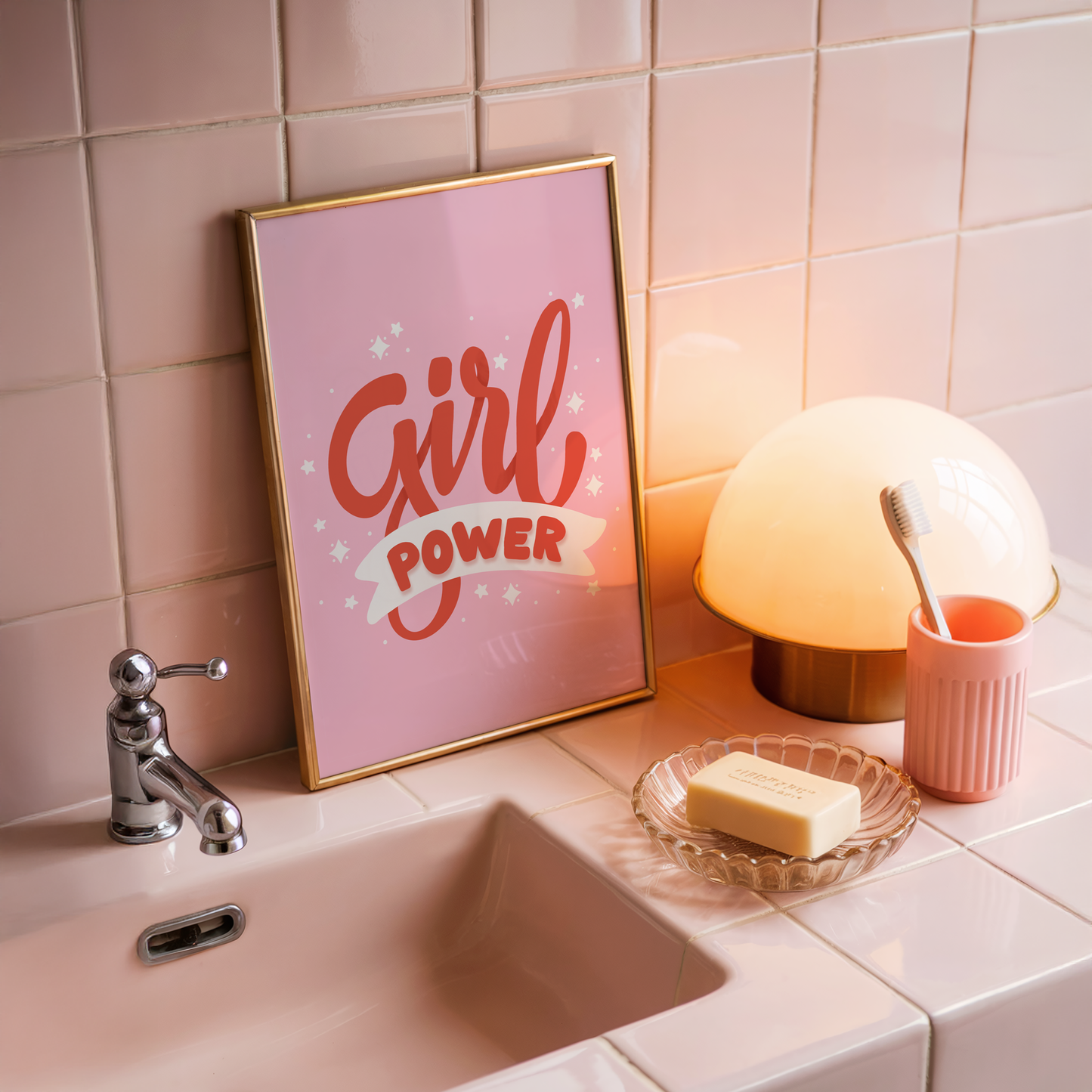 A quote print with the words 'Girl Power' in red text on a pink background.