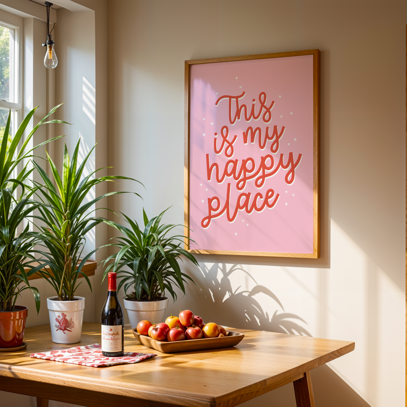 Home interior with a table, plants, wine bottle, and 'This is my happy place' framed text on the wall.
