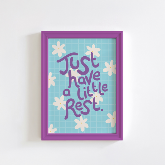 Framed artwork with 'Just have a little rest' text and floral design on a light blue background.