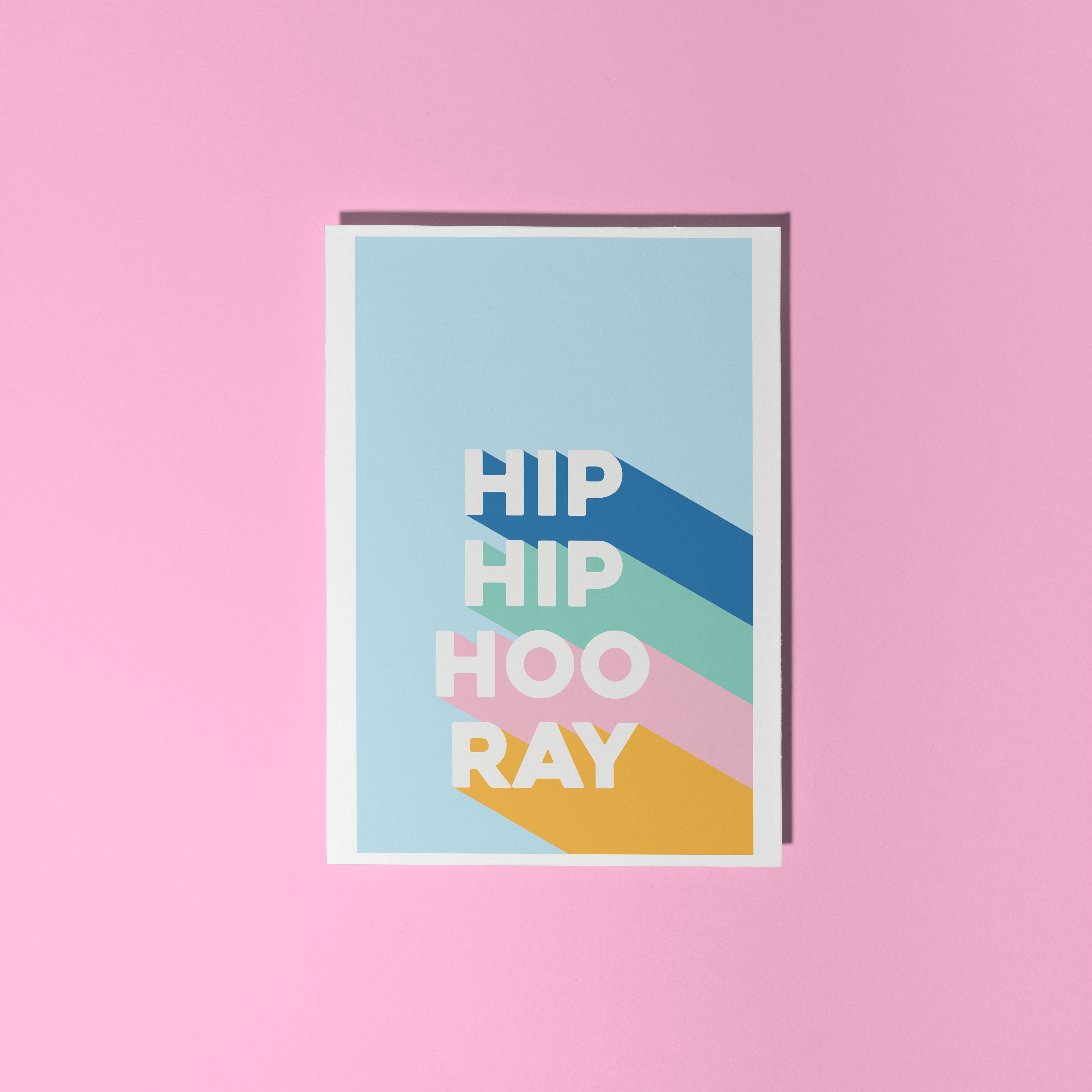 A congratulations card, saying Hip Hip Hooray in blue, green, pink and yellow.