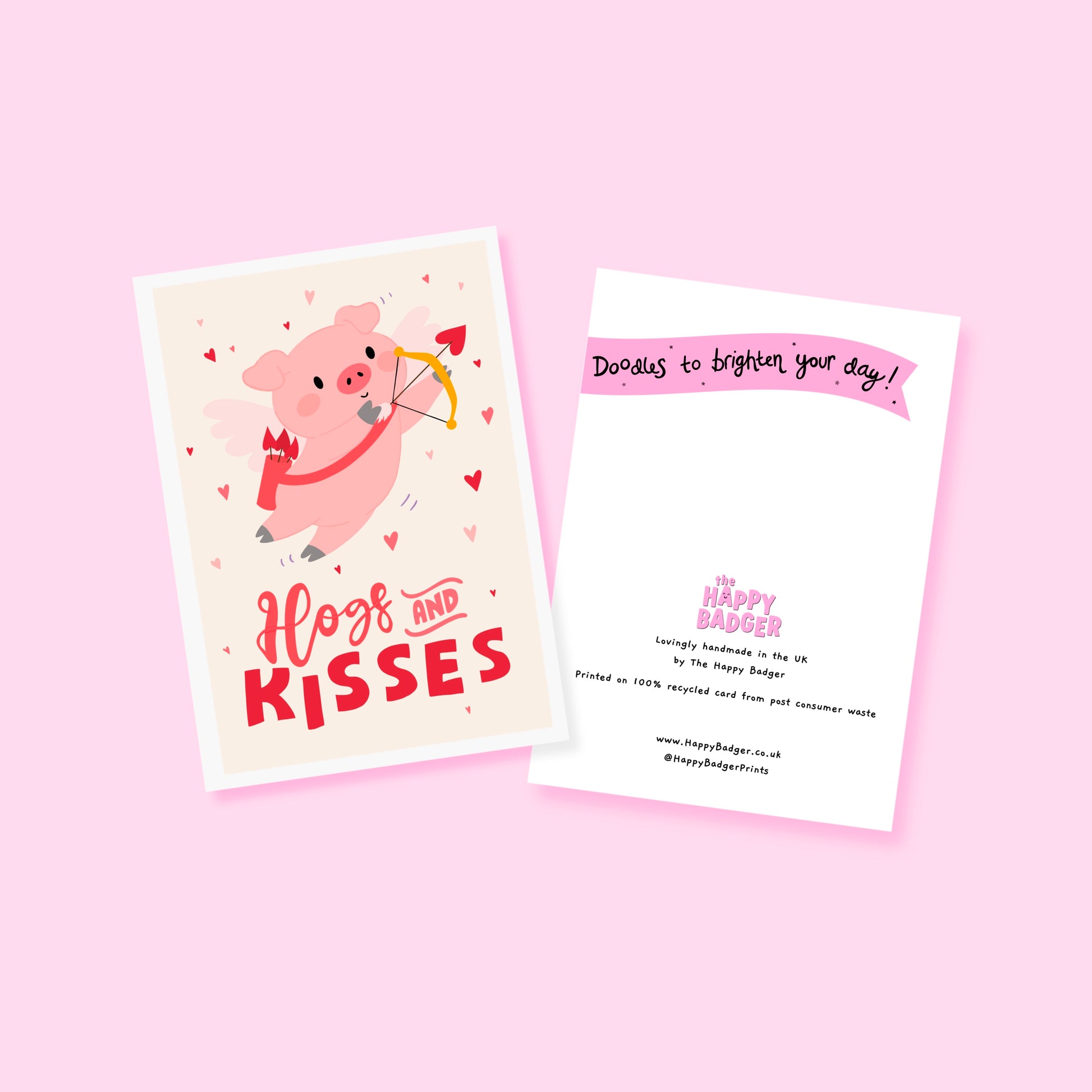 Card with a pig illustration dressed as cupid, with 'Hog and Kisses' hand written on the front of the card.