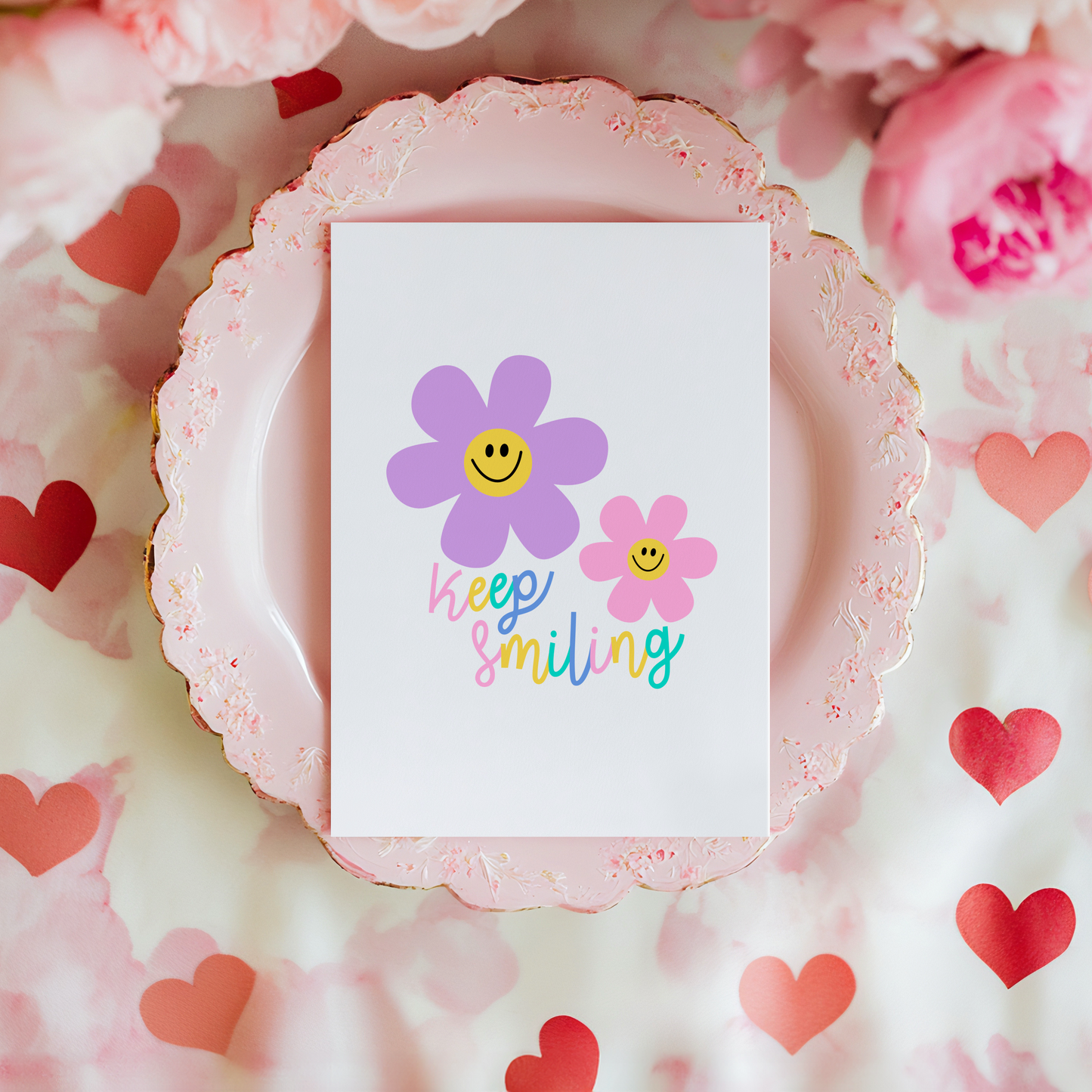 a card with two smiling flowers on the front and text that reads 'keep smiling'