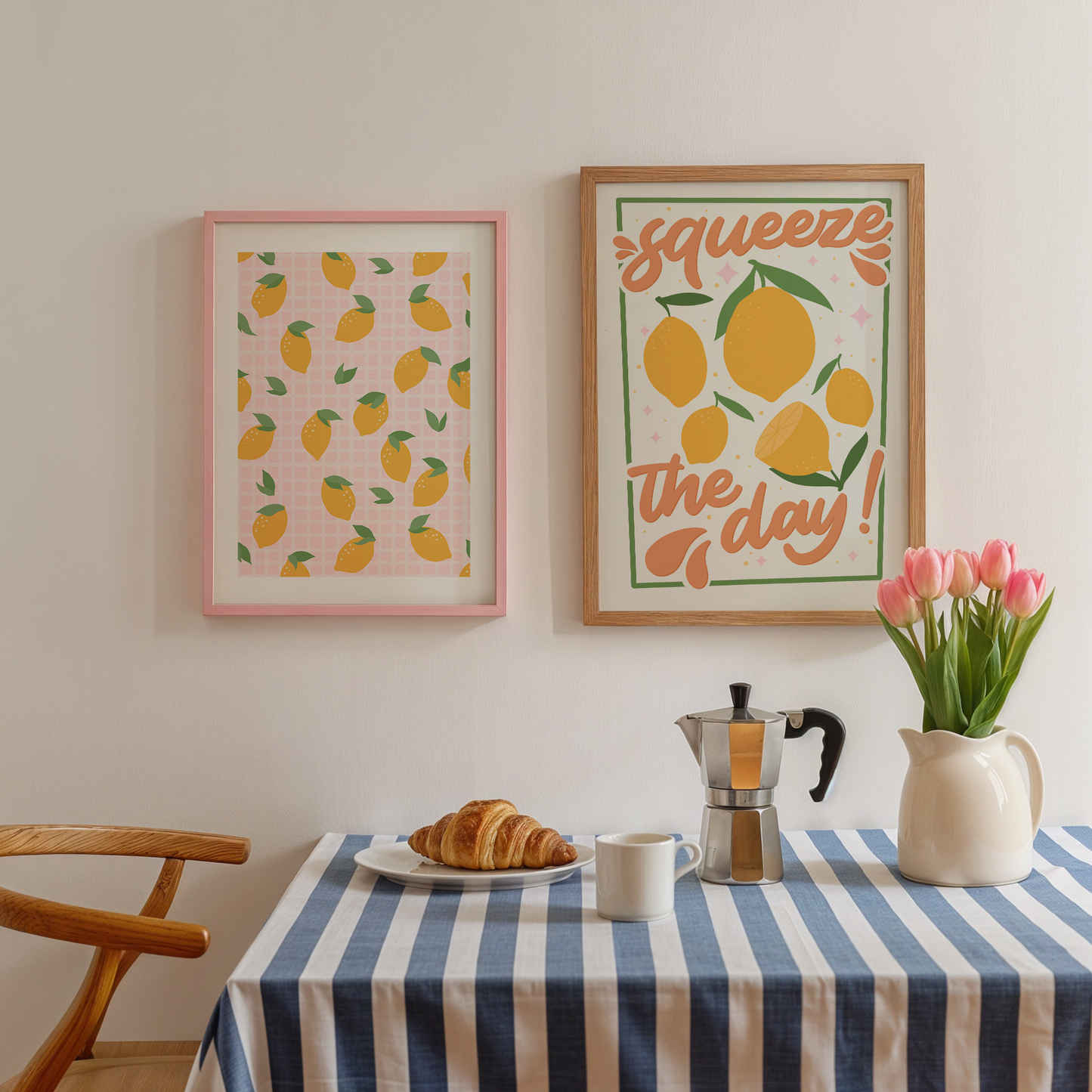 A framed art print with a pattern of yellow lemons on a pink checkered background.