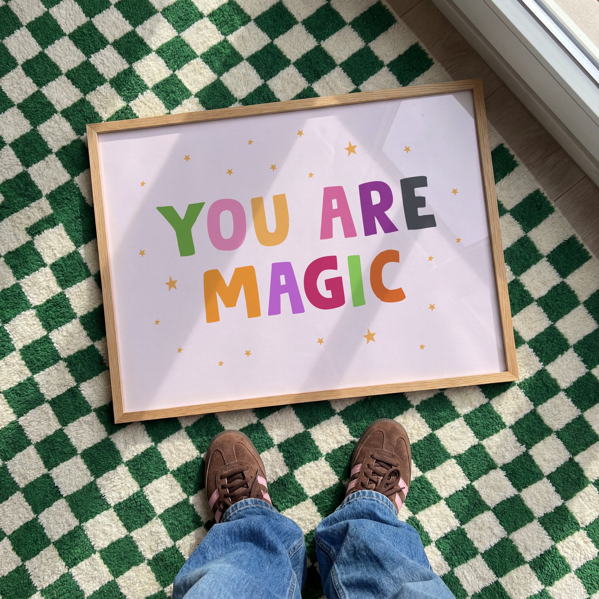 A colourful quote print that reads 'YOU ARE MAGIC' in bright and bold Halloween themed colours.