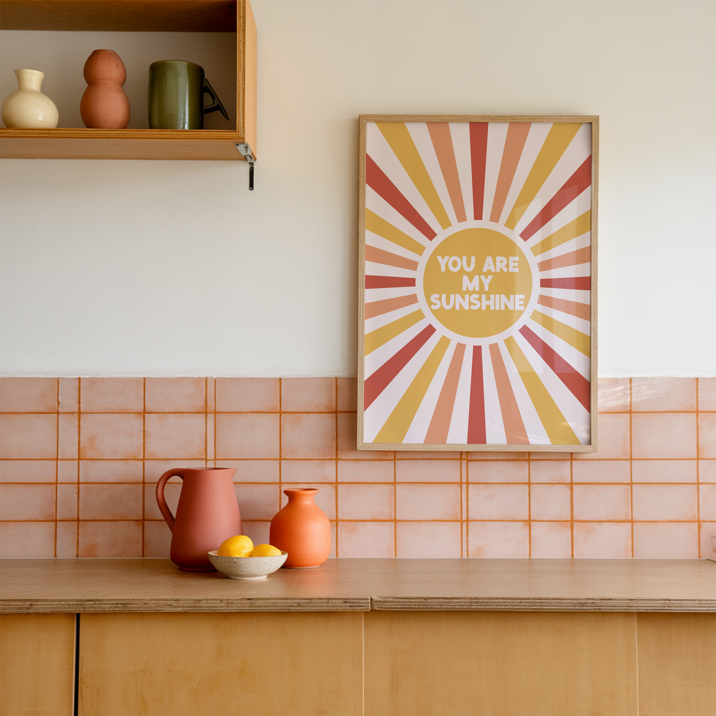 A fun quote print with text saying you are my sunshine, on a star burst background in orange yellow and red.