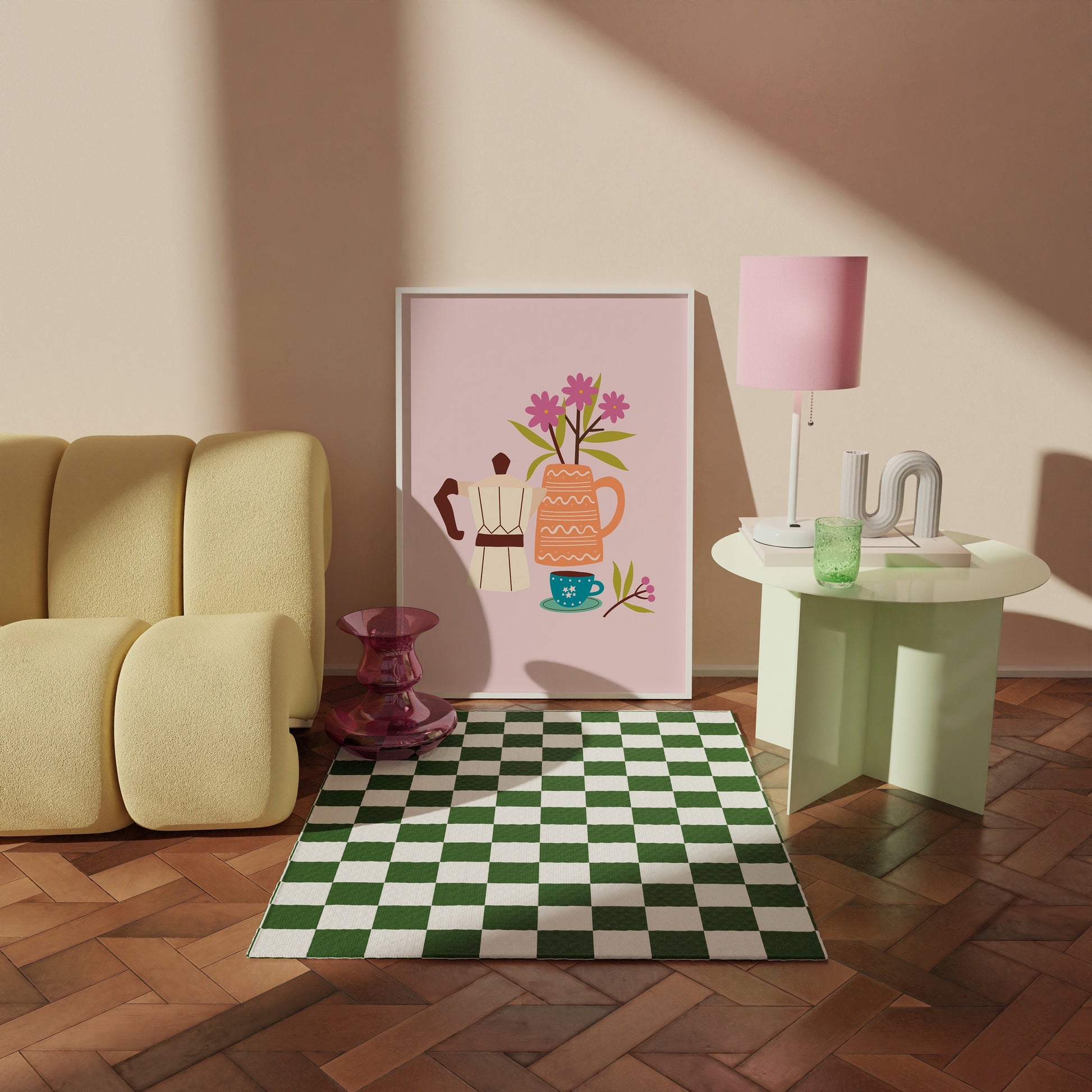 An illustration print, of a cafetière of coffee, a small mug and a vase of pink flowers. The print is on a pink background.