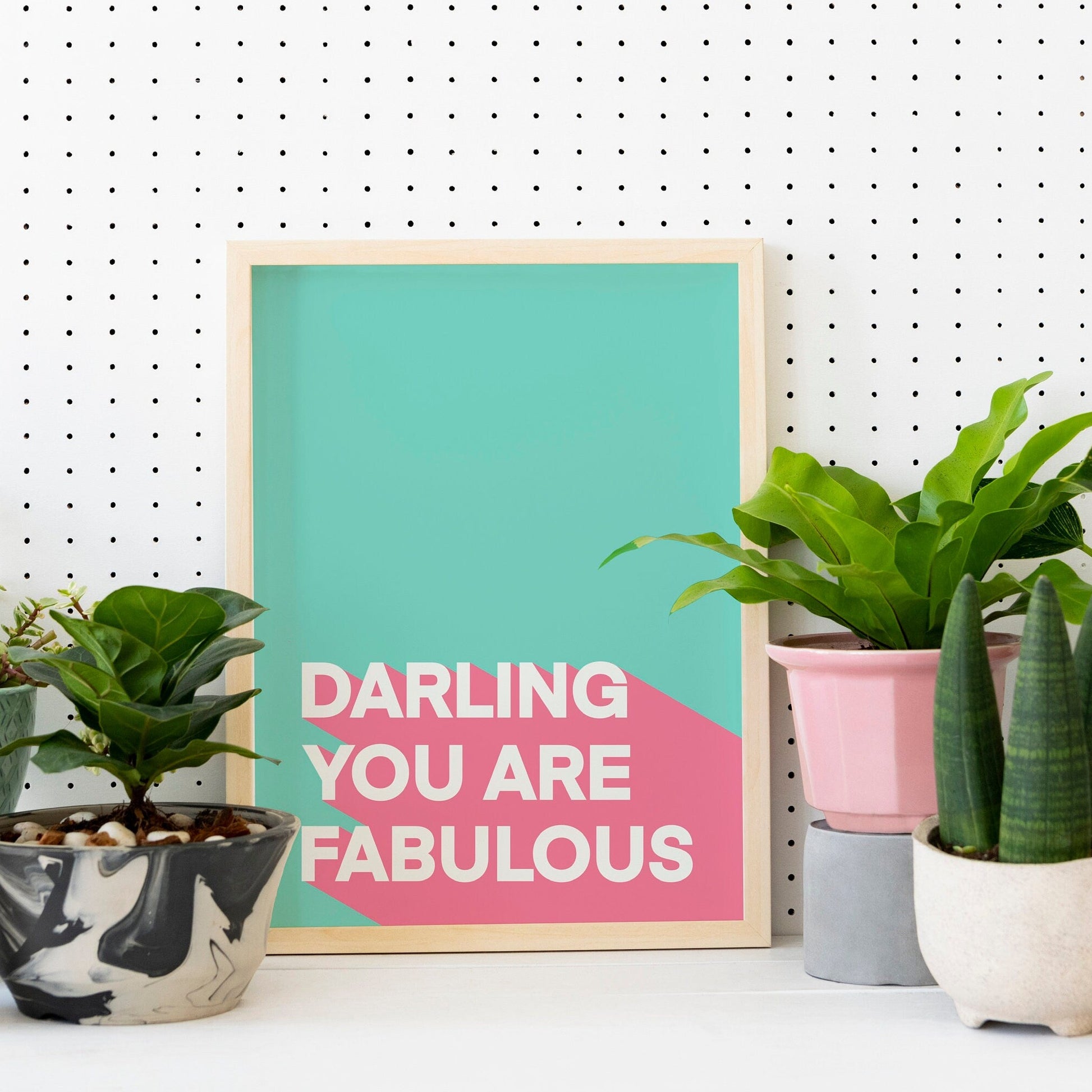 A teal and pink print, with the words 'darling you are fabulous'.
