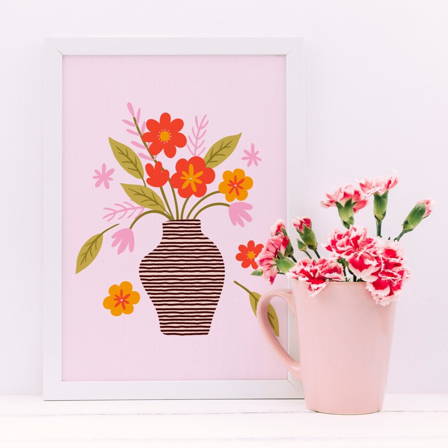 An illustration of aa vase of flowers, in shades of red, green and pink, shown in a frame.