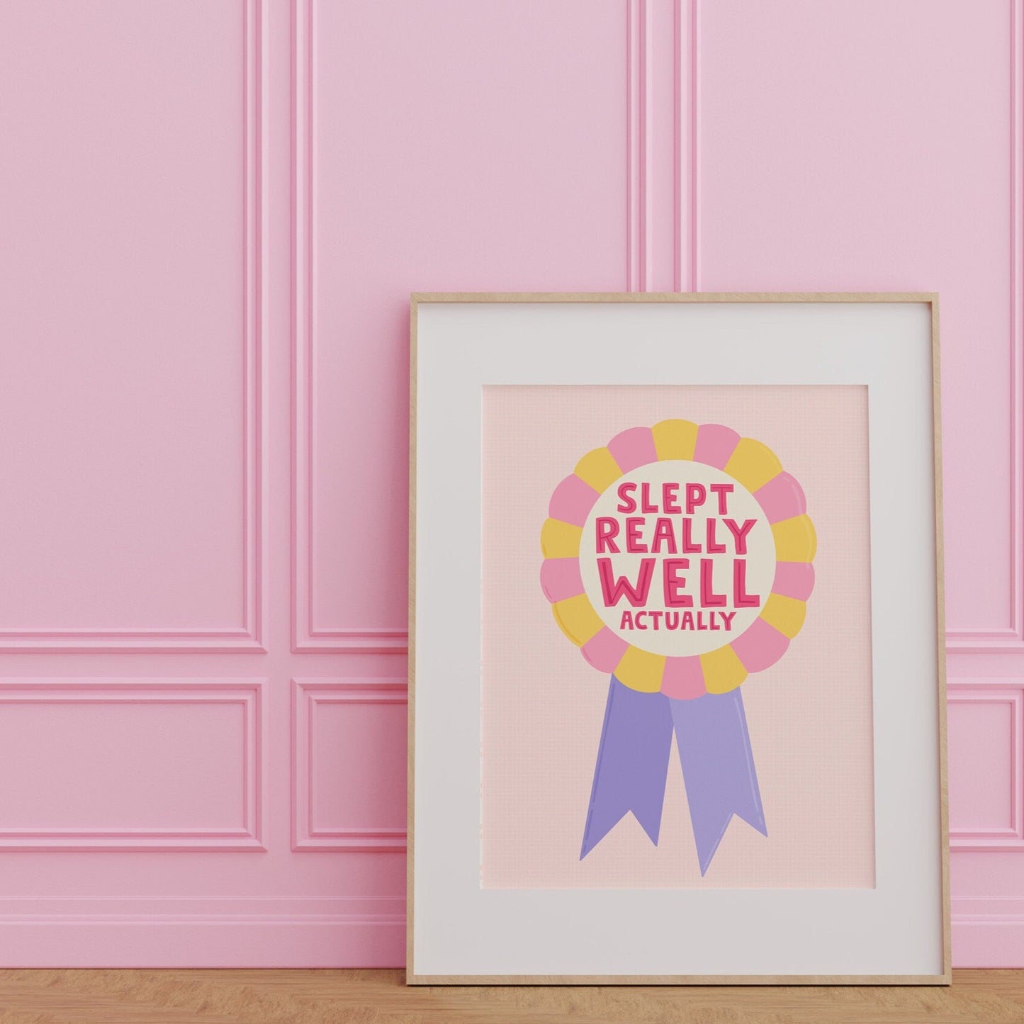 A colourful art print with the text 'SLEPT REALLY WELL ACTUALLY' on a pastel background.